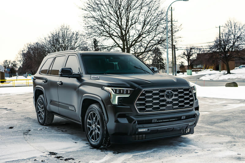 Dark grey Toyota full-size SUV parked on a snowy lot