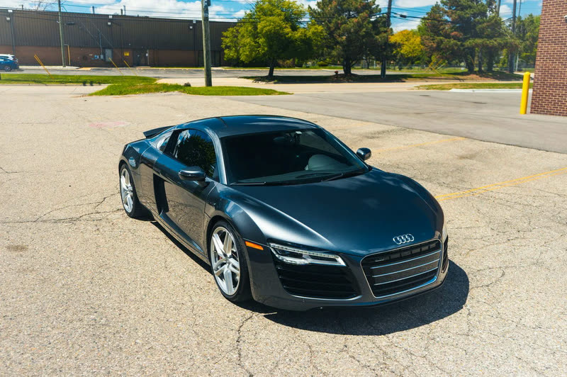 Window Tint in Livonia, MI: dark grey Audi R8, front three-quarter view