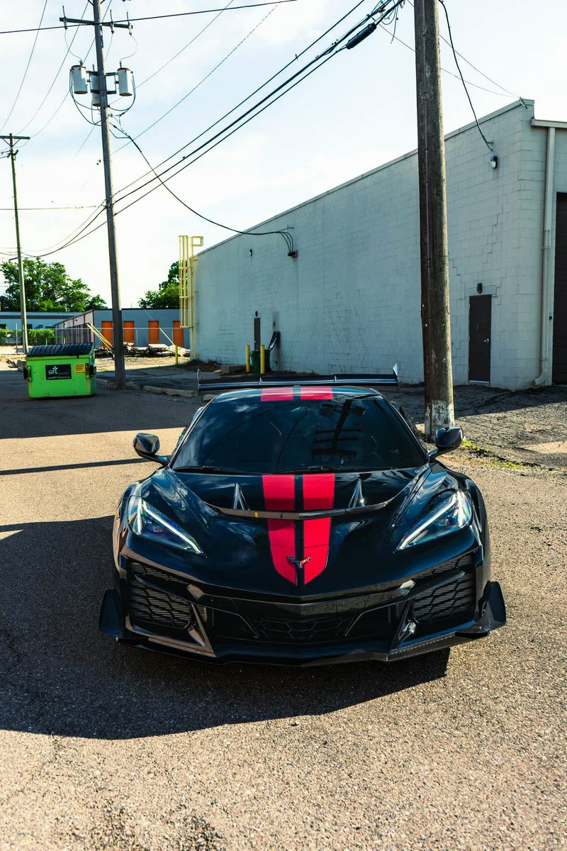 Black Corvette ZR1 with red stripes, front view