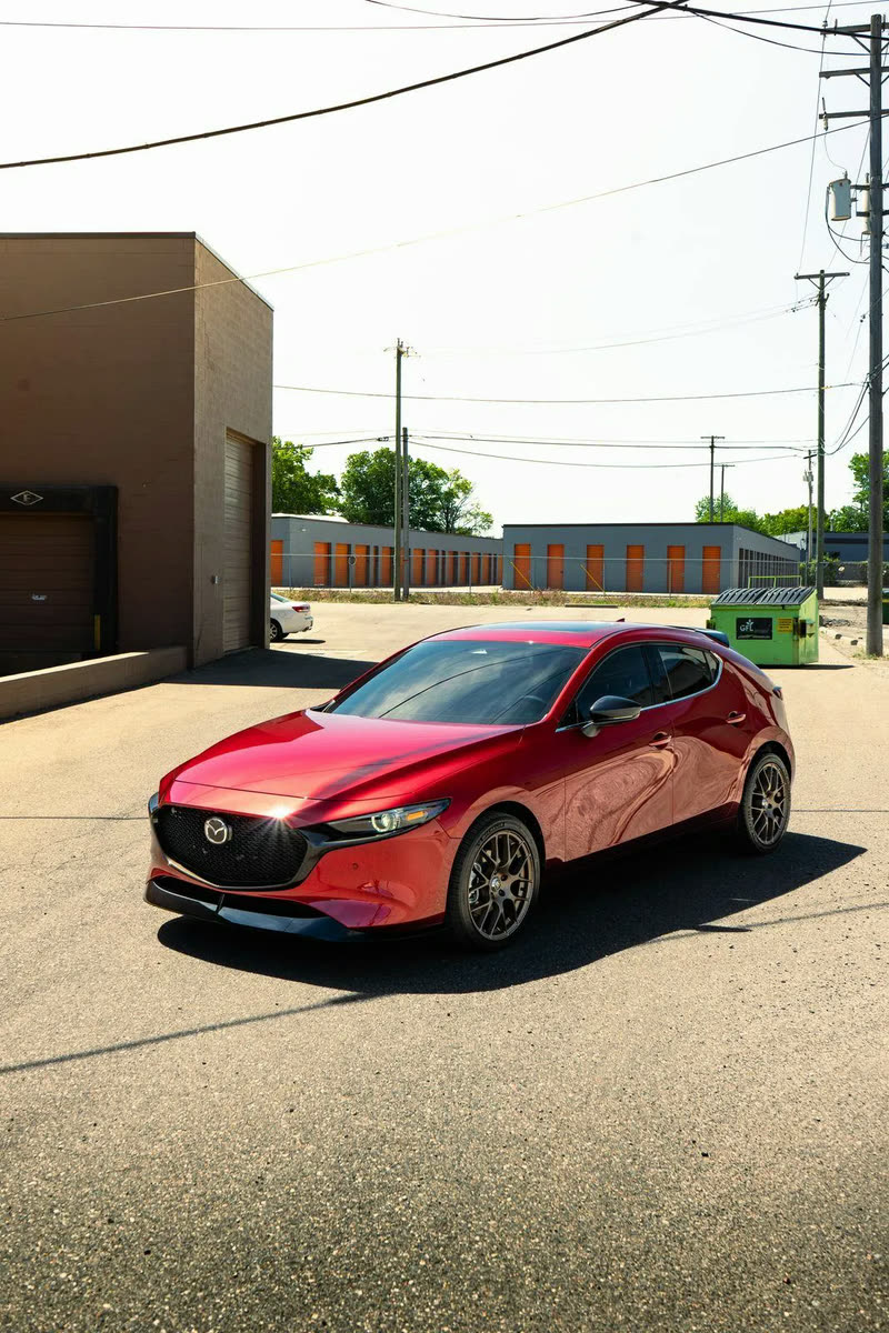 Red Mazda3 Turbo hatchback, front three-quarter view